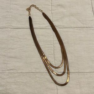 20 inch. Gold colored herringbone chain three layered necklace